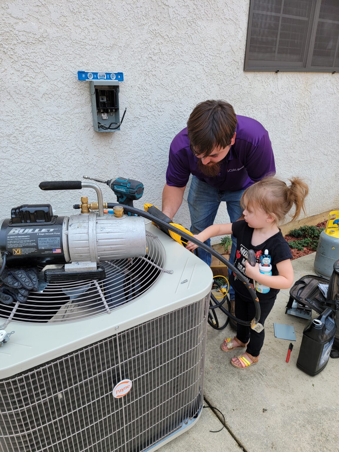 Dad and Daughter Working on a Condenser